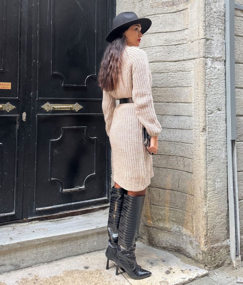 model styling plain knit crew neck dress with belt and boots