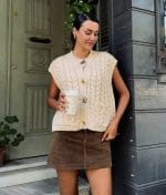 buttoned knit vest styled with mini skirt