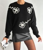 Embroidered Floral Crew Neck Sweater with white flower details on black knit fabric