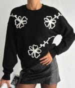 Embroidered Floral Crew Neck Sweater with white flower details on black knit fabric
