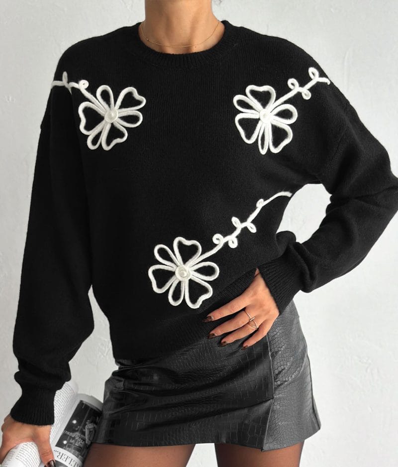 Embroidered Floral Crew Neck Sweater with white flower details on black knit fabric