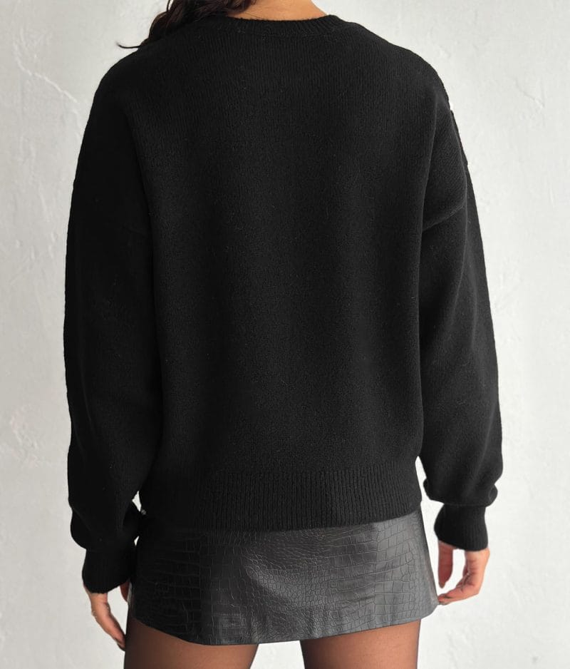 Embroidered Floral Crew Neck Sweater with white flower details on black knit fabric