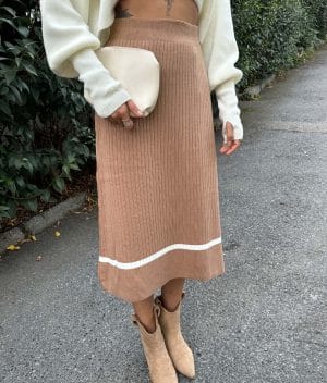 close-up of rib knit skirt with white stripe hem detail