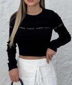 Close-up of sweet lettering cropped sweater