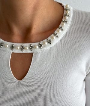 Keyhole neckline white knit top with decorative bead details