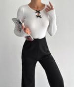 Bow detail knit top with keyhole neckline and long sleeves – front view