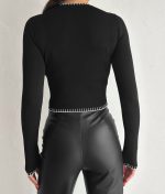 Elegant black contrast stitch knit top, perfect for wholesale women’s knitwear collections.