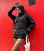 Women’s black knit pullover with scattered pearl accents
