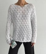 model wearing vertical wave open knit sweater