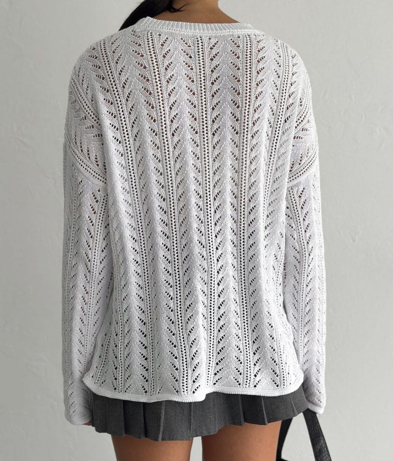 model styling white open knit chevron stripe sweater