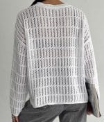 model wearing open knit horizontal stripe sweater