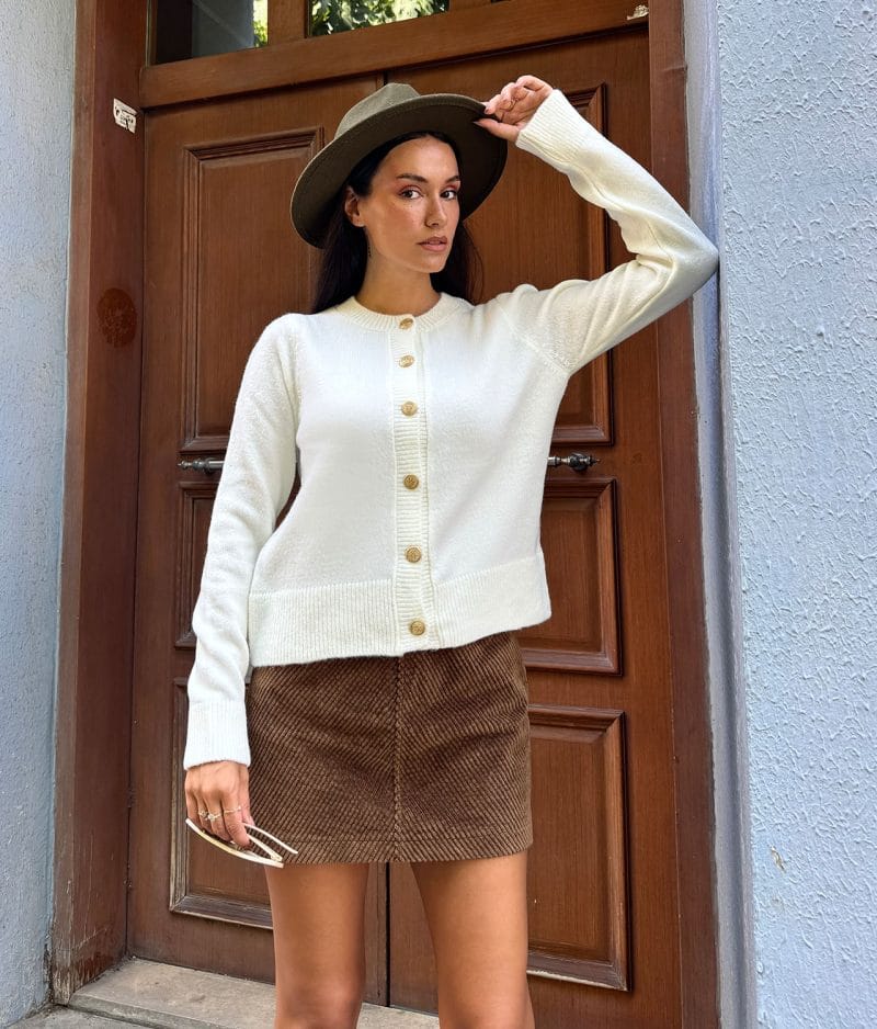 long sleeve button front cardigan styled with mini skirt
