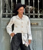 fashion model wearing textured knit button front vest