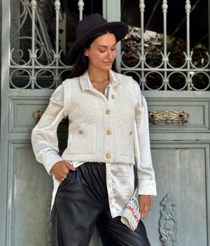 fashion model wearing textured knit button front vest
