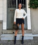 elegant button front cardigan styled with black skirt