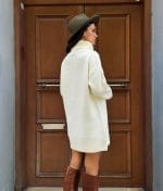 off-white turtleneck sweater dress with elegant pearl trim