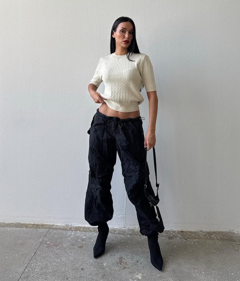Classic cable knit pullover short sleeve editorial shot