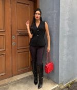 Women’s buttoned V neck knit vest designed for minimalist styling