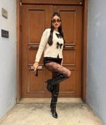 Women’s knit cardigan featuring elegant bow accents on the front
