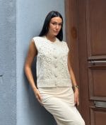 Embroidered Floral Knit Vest textured floral knitwear on model