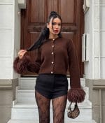 Feather cuff knit cardigan with statement sleeve detail and button front