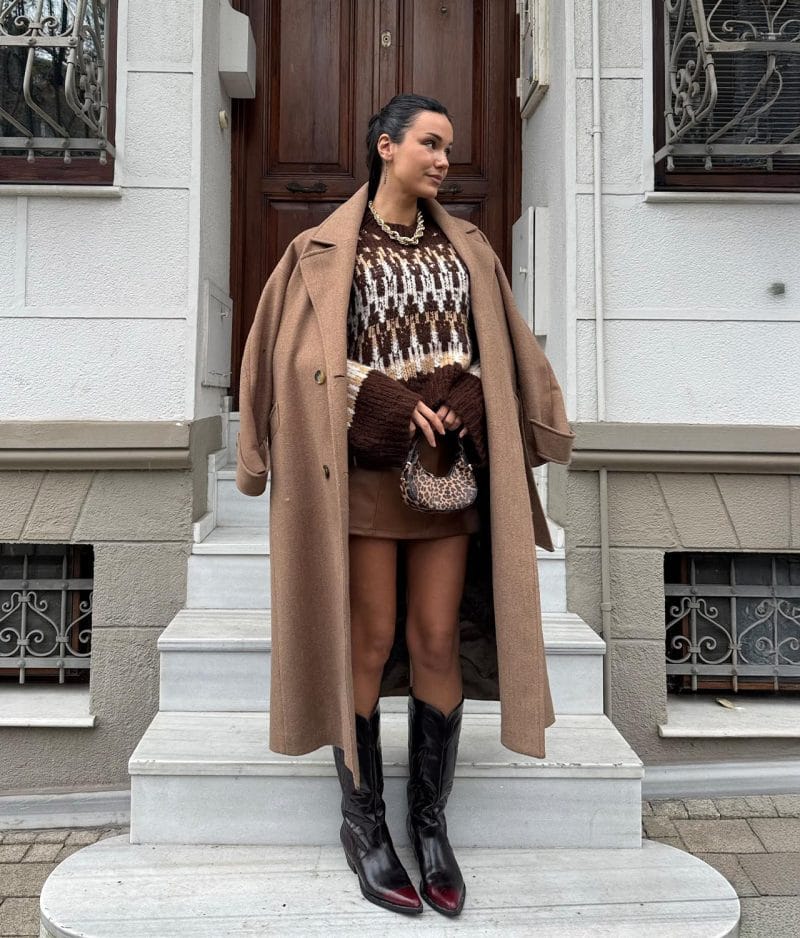 Cozy patterned knit sweater styled with mini skirt