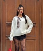 Knit sweater with decorative scarf neckline detail