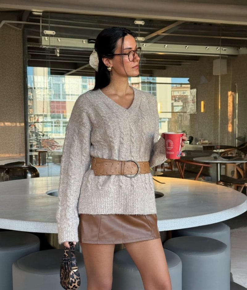 Cable knit V neck sweater with textured knit pattern