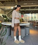 Classic cable knit V neck sweater styled with belt