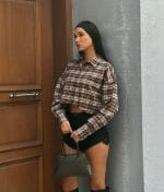 Cropped plaid button-down shirt collar and placket close-up