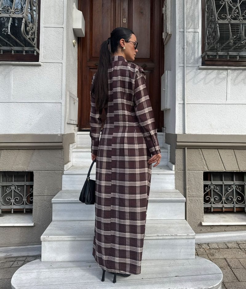 Plaid shirt dress styled with tall boots