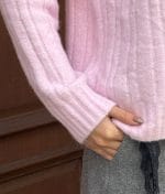 Textured knit sweater sleeve close-up